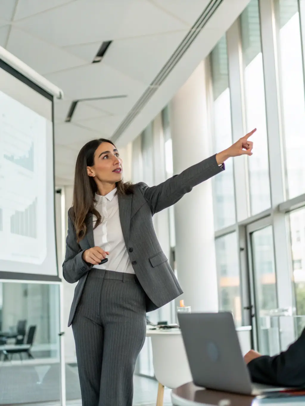 A confident individual leading a workshop or presentation, symbolizing the Community Leader Membership tier, highlighting leadership and influence.